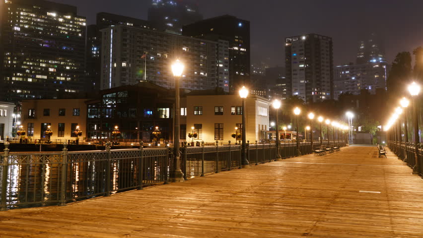 San Francisco Downtown Skyline from Pier 7 Night Time Lapse Pan L California USA