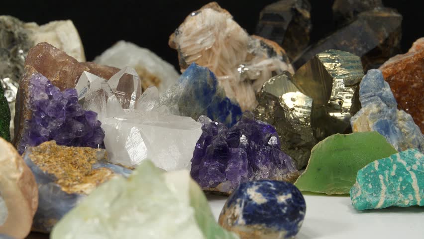 Semi Precious stones and minerals. Purple Amethysts, Quartz crystals, blue Lazurite, Agate, Green garnet or Uvarovite, green Nephrite and Amazon stone, Citrine, Barite, blue Kyanite and golden Pyrite