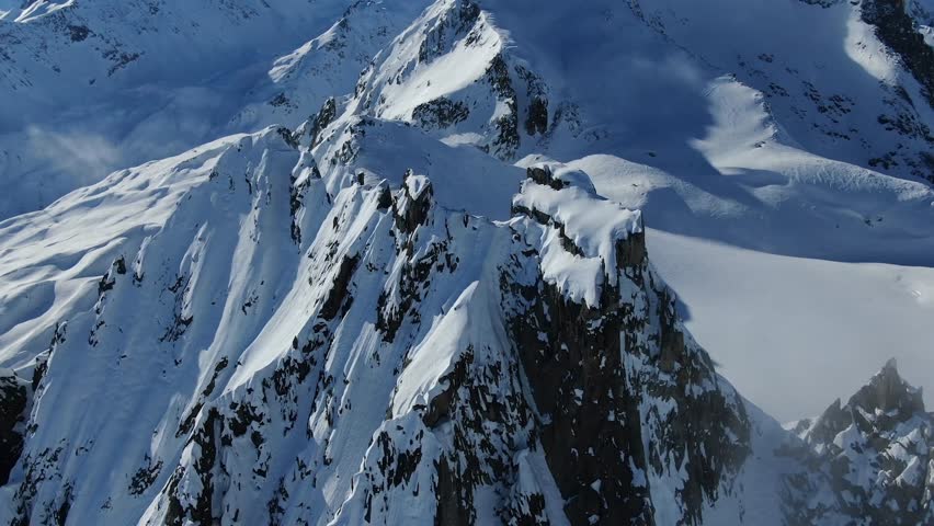 A stunning 4K view of the majestic Mont Blanc massif, the highest mountain in the Alps, featuring snow-capped peaks and glaciers in the border region of France and Italy.