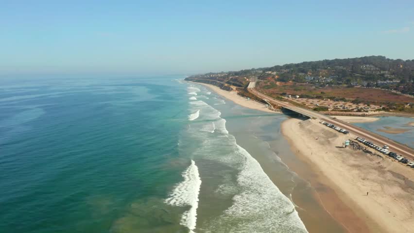 Aerial view of San Diego’s scenic coastline along the Pacific Ocean, showing sandy beaches, blue water, and stunning California coastal landscapes from above.