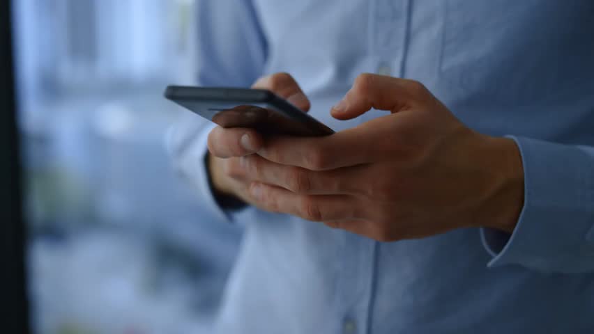 Professional using a mobile phone for online communication, highlighting digital networking, business connectivity, and modern workplace interaction. - Powered by Shutterstock - Get 15% off with code: PIKWIZARD15