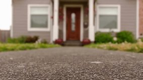 Exterior of a quaint American home with focus rolling to reveal the front door, highlighting architecture, charm, and suburban lifestyle. - Powered by Shutterstock - Get 15% off with code: PIKWIZARD15