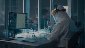 "Scientist in a hazmat suit researching coronavirus vaccine in a modern laboratory, highlighting medical research, safety, and scientific innovation." - Powered by Shutterstock - Get 15% off with code: PIKWIZARD15