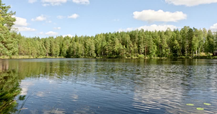 Landscape view of Ylinen Niemisjärvi lake in summer with clouds in the sky, Evo hiking area, Hämeenlinna, Finland