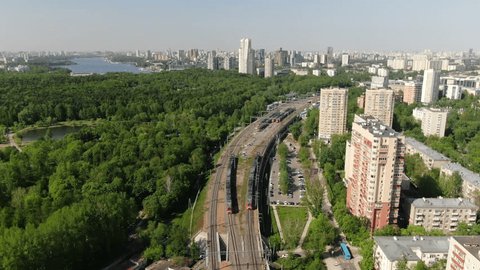 Static Aerial View Trains Forested Cityscape