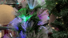 Vibrant fiber-optic Christmas tree lights in multiple colors create a festive centerpiece perfect for holiday decor, celebrations, and cozy home settings. - Powered by Shutterstock - Get 15% off with code: PIKWIZARD15