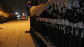 Wooden fence in the snow, heavy snowfall on a street, street sign in the snow, truck under the snow, Moosburg an der Isar, Germany, Bavaria, 1 December 2023 - Powered by Shutterstock - Get 15% off with code: PIKWIZARD15