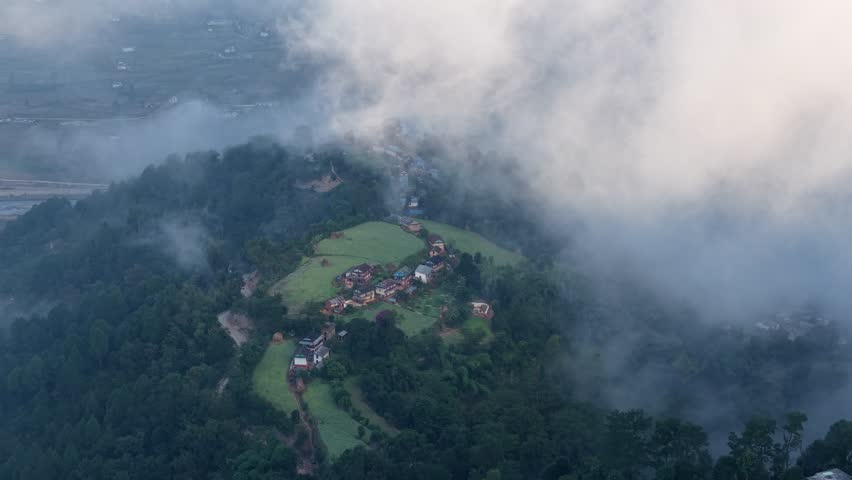 Misty and cloudy hills of Nepal — dramatic mountain landscape, lush green slopes, and serene Himalayan countryside atmosphere.