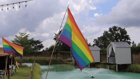 LGBT Pride flag is waving. Symbol of LGBT, gay, lesbian, peace, pride,  bisexual, homosexual, transgender, and love. - Powered by Shutterstock - Get 15% off with code: PIKWIZARD15