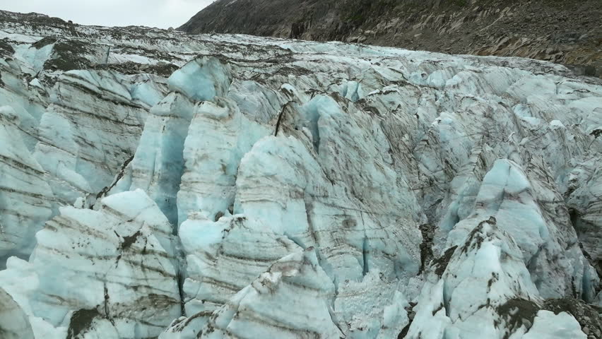 A drone shot of towering ice pinnacles and deep crevasses on the Argentiere Glacier in the Mont Blanc massif in the French Alps