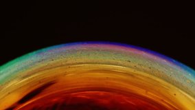 Macro shot of colorful soap film forming a gas-giant planet look, with flowing atmospheric bands, glowing gradients and cosmic textures against a deep dark background. - Powered by Shutterstock - Get 15% off with code: PIKWIZARD15