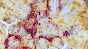 Pepperoni topping on pizza, Pepperoni is an American variety of spicy salami made from cured beef seasoned with paprika and chili peppers, Italian pizza with pepperoni toppings - Powered by Shutterstock - Get 15% off with code: PIKWIZARD15