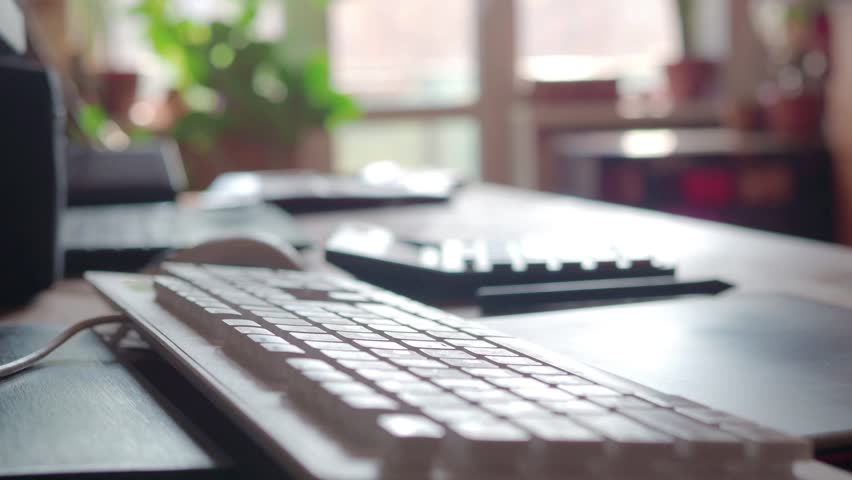 Man searching information with pc touch pad. Male fingers is typing on touchpad of black laptop with keyboard. Selective focus. FHD footage.