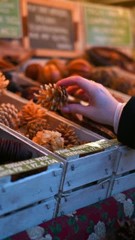 close up of christmas market stalls with festive decorations and handmade gifts
