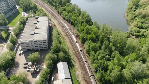 Drone Shot Curved Railway beside Lake Green