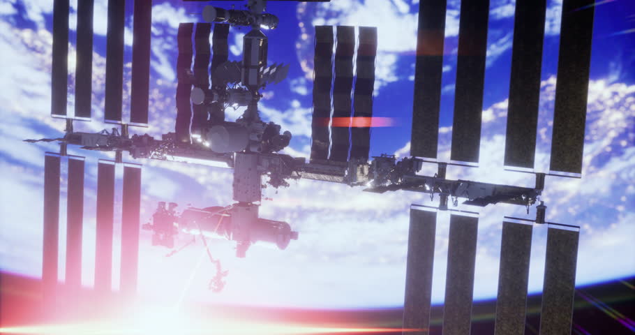 The International Space Station floats above Earth, capturing a stunning view of the planets surface just as a colorful sunset illuminates the atmosphere.