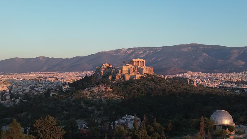 Athens, Greece - November 16th, 2025 - footage of historical center, archeological sites, Acropolis, Filopappou hill, monuments, Lycabettus hill, panorama of the city, observatory in sunset time