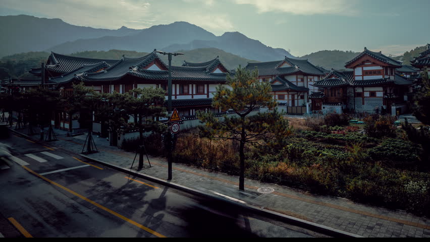Traditional Korean Hanok Village with mountain backdrop in South Korea – timelapse 