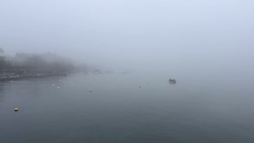 Zurich, Switzerland. November 5, 2025. Foggy Zurich Lake. On the left side of the shore, you can see the Zurich Opera House.