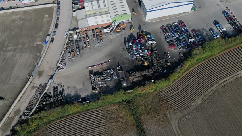 Aerial view of damaged vehicles and salvage yard in rural area after fire incident at Copart yard, York, North Yorkshire.
