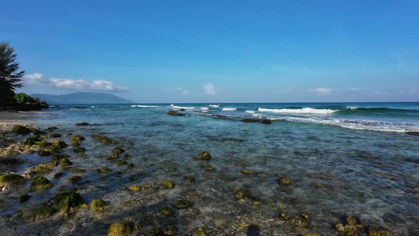 Waves crashing onto a rocky shoreline
