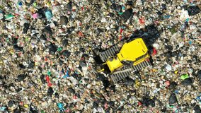 Drone shot above heavy machinery processing garbage, illustrating waste management efforts, environmental impact, severe waste pollution, operational efficiency, and rising sustainability awareness. - Powered by Shutterstock - Get 15% off with code: PIKWIZARD15