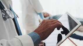 Senior doctor using a tablet in his office, reviewing patient information digitally, highlighting modern healthcare and medical technology. - Powered by Shutterstock - Get 15% off with code: PIKWIZARD15