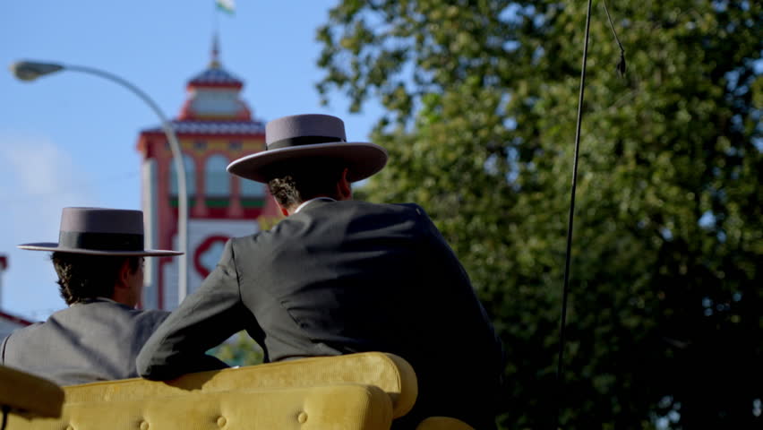 Iconic archway entrance of the Feria de Abril glowing under afternoon light