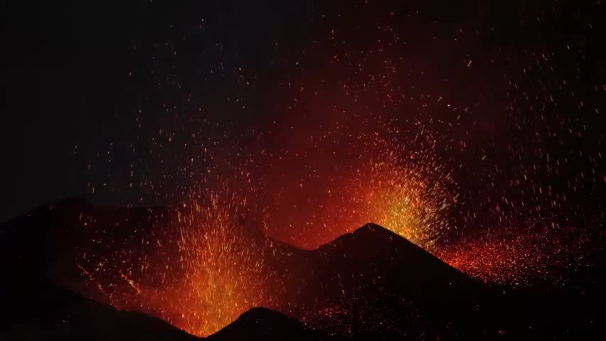 A dramatic explosive Strombolian eruption from two vents on Pico do Fogo volcano, showcasing lava fountains, volcanic ash, and the raw power of nature.