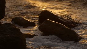 Ocean waves spume over cliff stone at sunset sky golden color sunrise - Powered by Shutterstock - Get 15% off with code: PIKWIZARD15