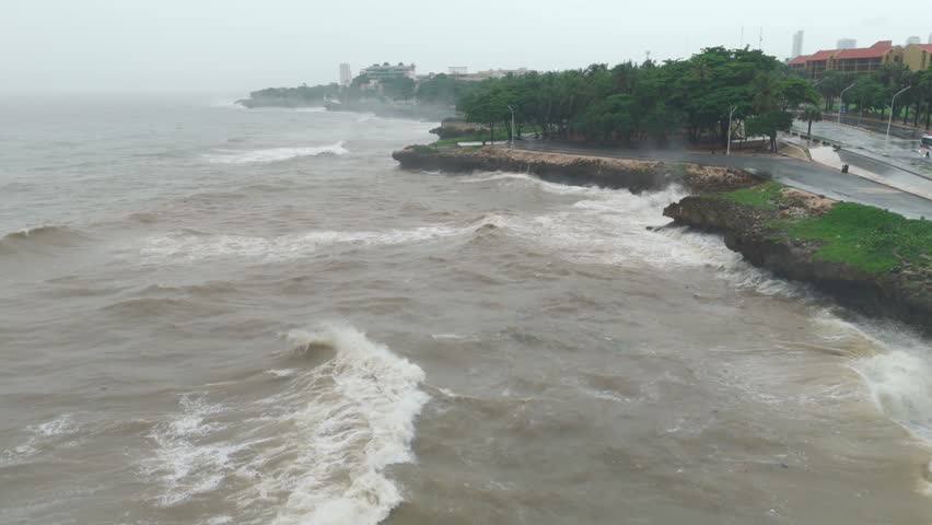 Waves Crashing On Coast of Malecon Of Santo Domingo During Tropical Storm Melissa In Dominican Republic. aerial shot