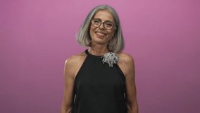 Woman with outstretched arms and open hands reaching forward in studio with pink backdrop; warmth connection openness. - Powered by Shutterstock - Get 15% off with code: PIKWIZARD15
