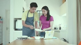 A joyful couple working together in the kitchen, preparing a meal. The scene captures the essence of teamwork and culinary creativity, showcasing a delightful bonding experience through cooking. - Powered by Shutterstock - Get 15% off with code: PIKWIZARD15