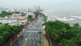 Wet Coastal Road With Powerful Sea Waves During Tropical Storm Melissa In Santo Domingo, Dominican Republic. aerial shot - Powered by Shutterstock - Get 15% off with code: PIKWIZARD15
