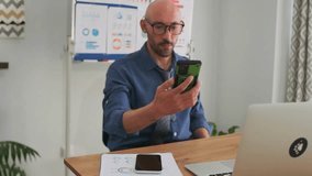 entrepreneur multitasks daily, startup founder manages work across multiple screens, modern startup entrepreneur swiftly transitions between devices while handling analytics and communication tasks - Powered by Shutterstock - Get 15% off with code: PIKWIZARD15