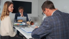 candidate being assessed at interview, professional office setting with tense interview involving candidate evaluation, caucasian candidate undergoing formal interview with manager and recruiter - Powered by Shutterstock - Get 15% off with code: PIKWIZARD15