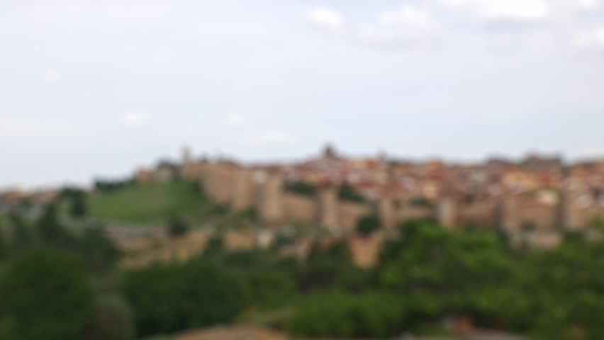 Panoramic view of the historic city of Avila with its famous medieval city walls from the Cuatro Postes viewpoint, Spain.