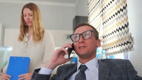 professional engaging on call, business professional actively engaging and smiling during work phone call, business professional is smiling and actively engaging during workrelated phone call - Powered by Shutterstock - Get 15% off with code: PIKWIZARD15