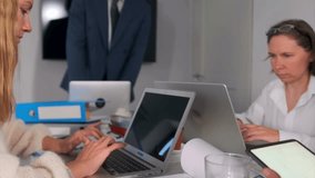 designers collaborating effectively, designers and managers working together peacefully at their desks, team of designers and managers collaborating harmoniously in tranquil office environment - Powered by Shutterstock - Get 15% off with code: PIKWIZARD15