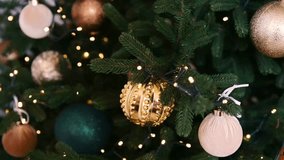 Close up of decorated evergreen branches with shiny baubles and warm lights, festive - Powered by Shutterstock - Get 15% off with code: PIKWIZARD15