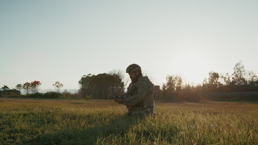 Sun Hitting On The War Field Over A Soldier In Prayer