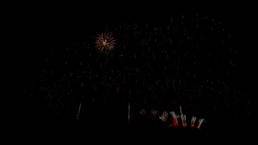 Beautiful colorful fireworks for celebration on dark background , New year holiday concept. shining fireworks bokeh lights in night sky. glowing fireworks show. New year