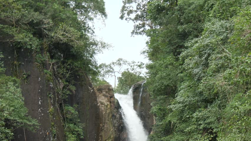 Torrent Streams Of Khlong Phlu Waterfall In Ko Chang, Thailand. Pan Down Shot