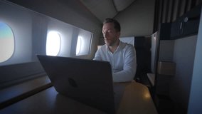 A businessman is successfully working remotely while traveling luxuriously in a private jet - Powered by Shutterstock - Get 15% off with code: PIKWIZARD15