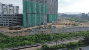 Drone Shot of High-Rise Apartment Construction Site and Rail Tracks. - Powered by Shutterstock - Get 15% off with code: PIKWIZARD15