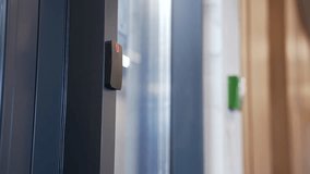 Close up of male hand using key card to open door of office with electronic smart lock. Businessman using identity keycard at sensor control security system. Smart card unlocks modern entry secure - Powered by Shutterstock - Get 15% off with code: PIKWIZARD15