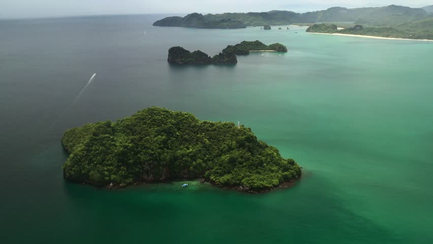 Overgrown with green jungles and tropical islands in Kilim Park on Langkawi Island, surrounded by clear turquoise waters. Malaysia