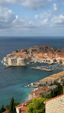 Dubrovnik old town view with historic city walls and Adriatic Sea background under cloudy sky video