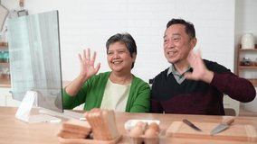 Happy Asian senior grandparents couple waving hand making online video call enjoying family virtual meeting digital webcam videocall chat talking, online network and chat. - Powered by Shutterstock - Get 15% off with code: PIKWIZARD15