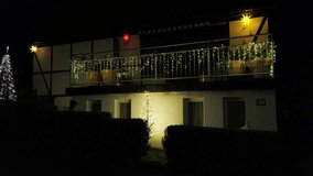 festive holiday scene, cozy home holiday lighting display, nighttime festive scene with illuminated roof and cozy atmosphere - Powered by Shutterstock - Get 15% off with code: PIKWIZARD15